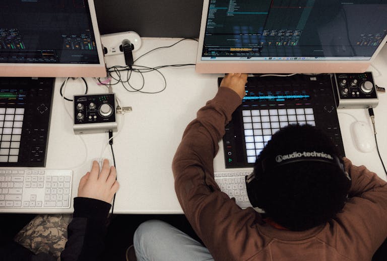A student working at a desk with Live and Push in front of them.