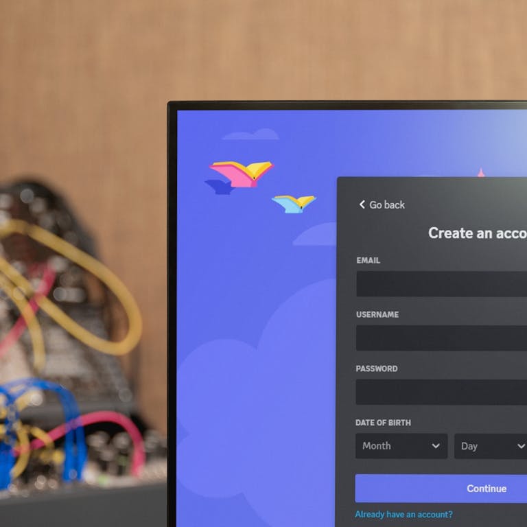 A cropped image of a monitor screen displaying Discord's account sign up page